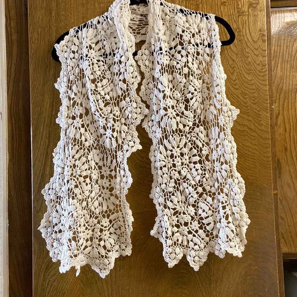 Lim’s beautiful, hand crocheted, uniquely designed, long, off white scarf.